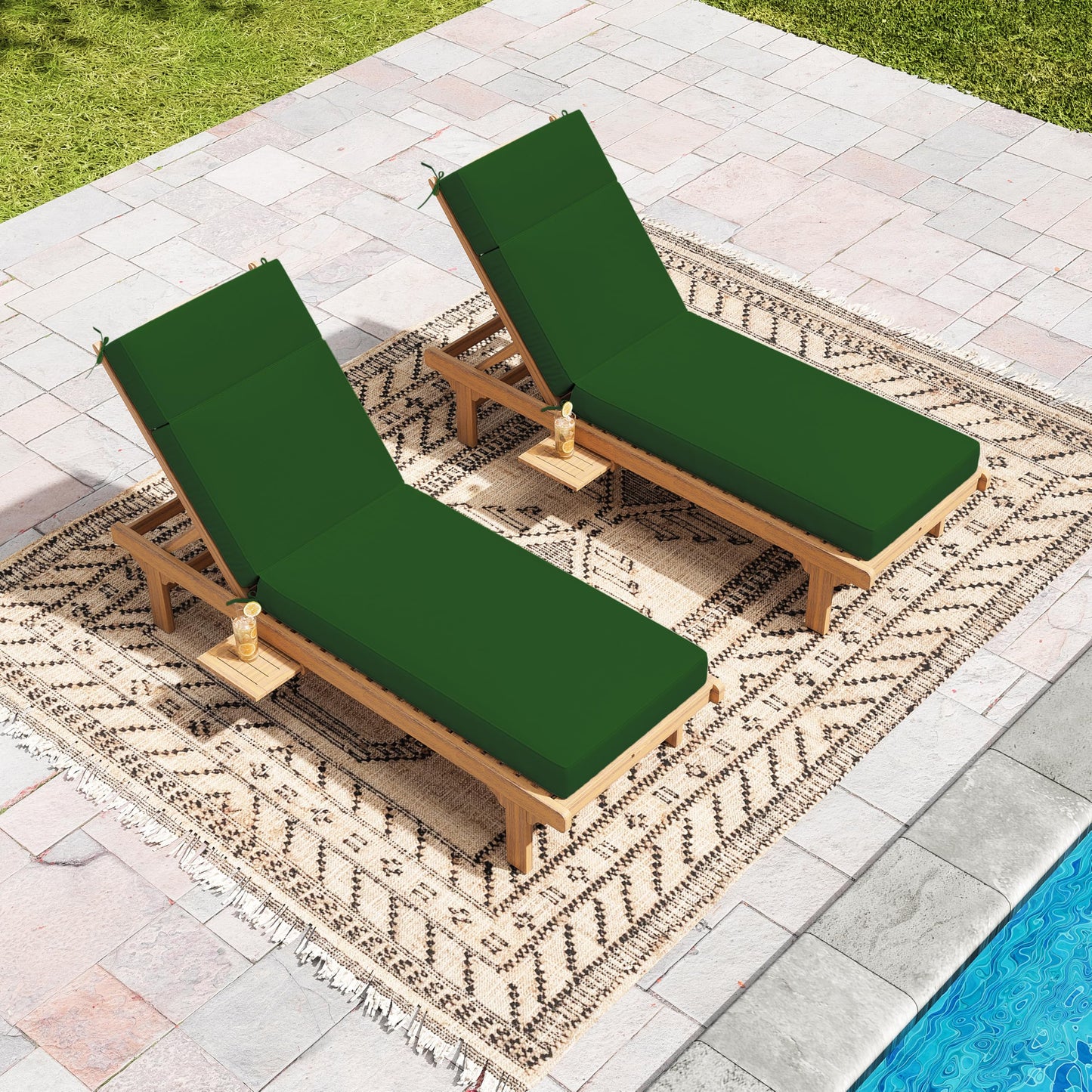 Two wooden lounge chairs with green cushions on a patterned rug by a pool.