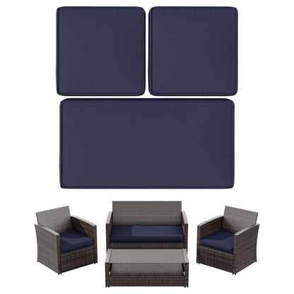 Outdoor patio furniture set with wicker armchairs, loveseat, coffee table, and navy cushions