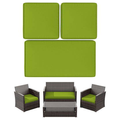 7-piece brown wicker patio furniture set with green cushions and glass coffee table