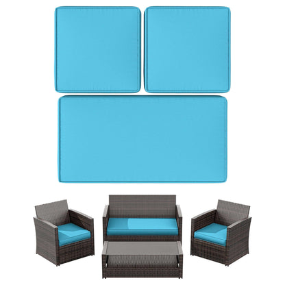 Outdoor wicker patio furniture set with blue cushions including two chairs, loveseat, coffee table, and cushion set