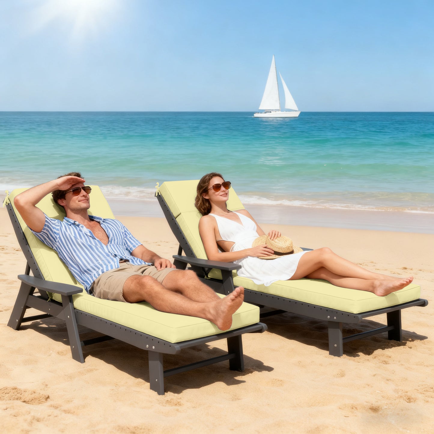 Two people relaxing on beach chairs with a sailboat in the background.