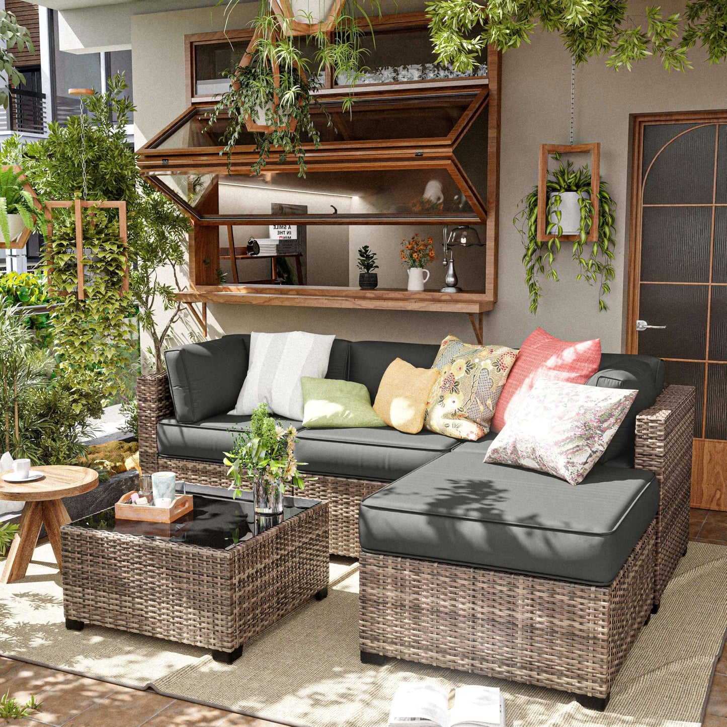 Outdoor patio furniture set with cushions in a garden setting