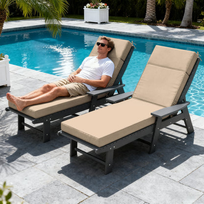 Man relaxing on a beige lounge chair by a pool with palm trees in the background