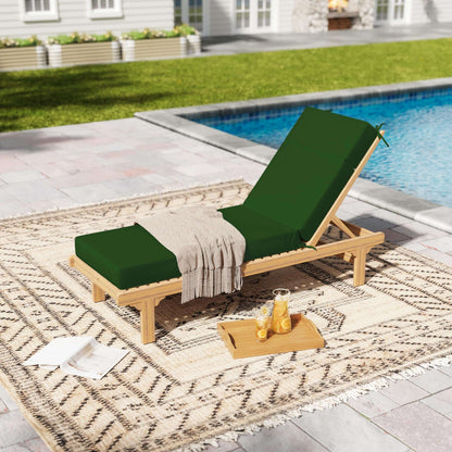 Wooden lounge chair with green cushions by a poolside on a patterned rug.