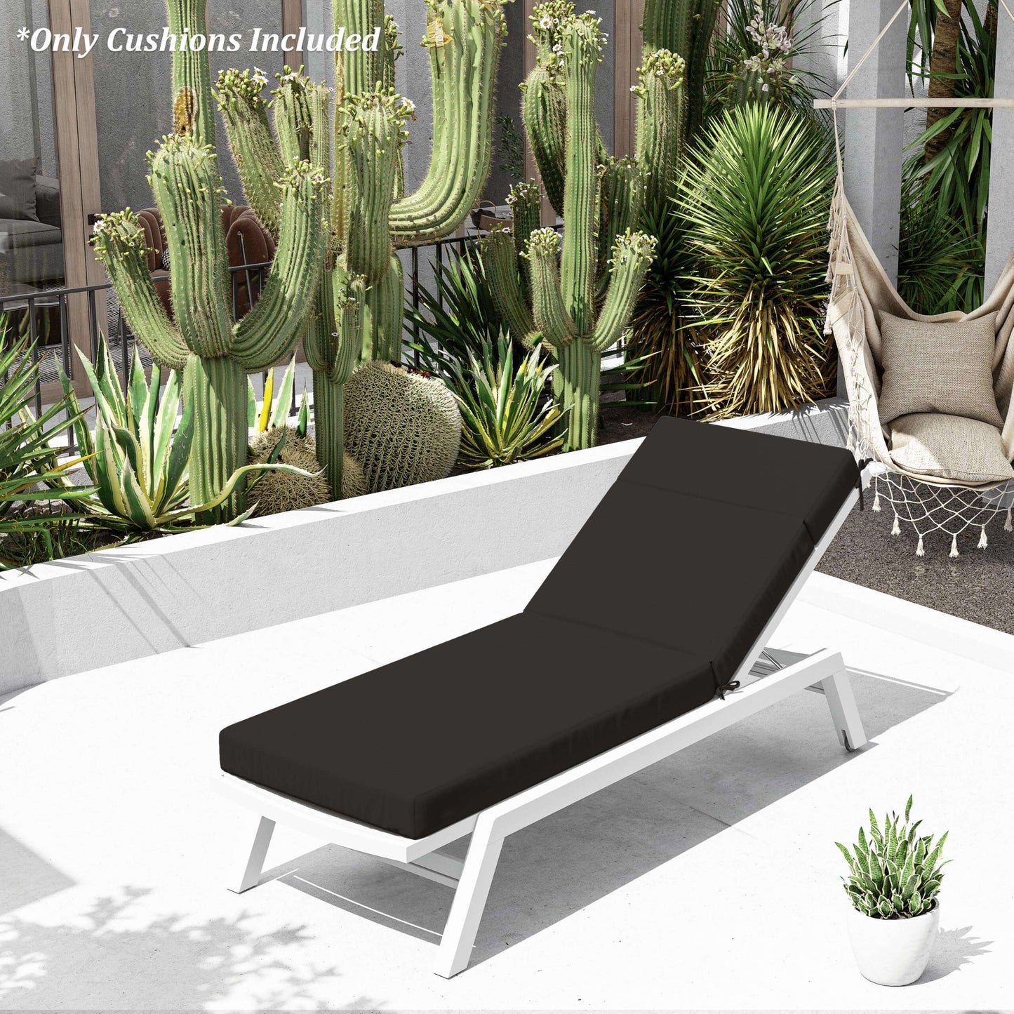 Black cushioned lounge chair on a patio with cacti and plants in the background