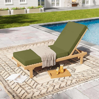 Wooden lounge chair with green cushions by a poolside