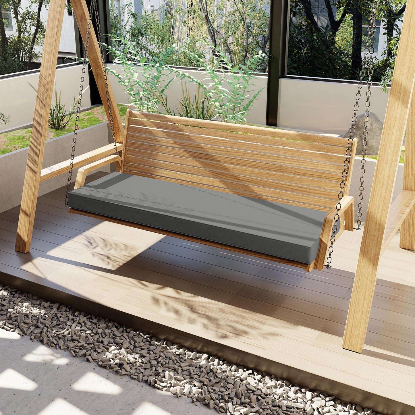 Wooden swing with a gray cushion on a wooden deck