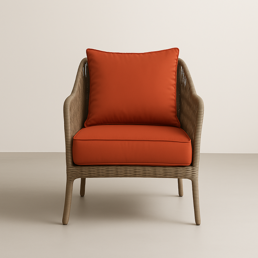 orange cushions on a wicker chair