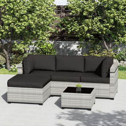 Modern gray wicker outdoor sectional sofa with black cushions and matching coffee table on patio