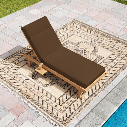 Brown lounge chair with cushion on a patterned rug by a poolside.